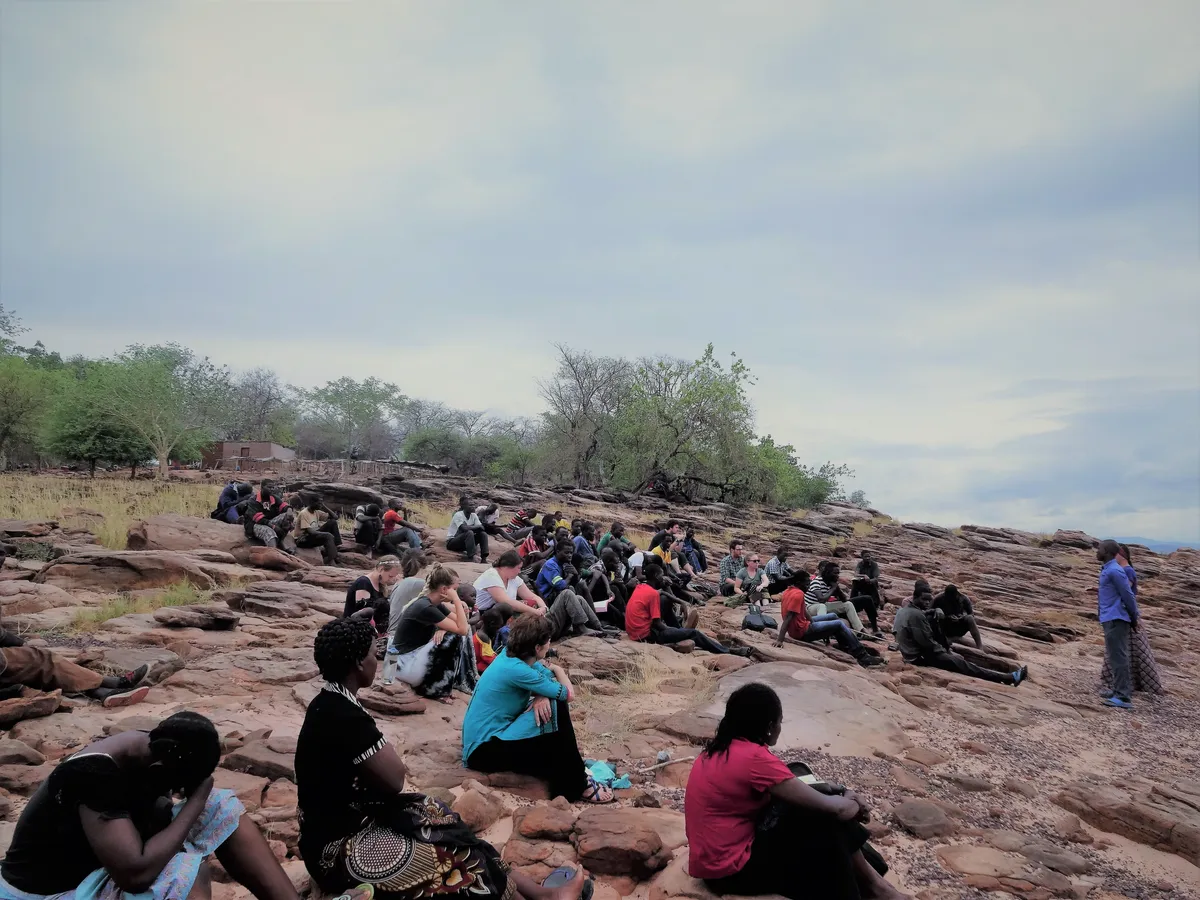 Community gathering on the rocks